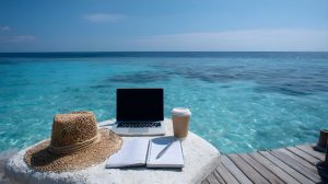 Working remotely from paradise with laptop and notebook on tropical beach