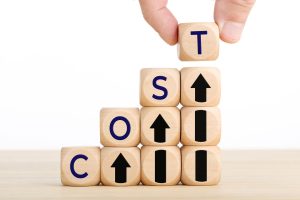 Hand holding wooden block with message