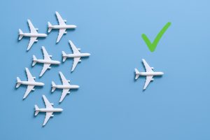 Airplane Formation with Approval Checkmark Concept for Travel, Success, and Destination on Blue Background