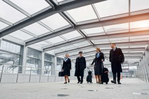 Airplane crew in uniform is going to the work together