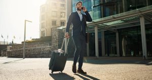 Business man walking outdoor to airport