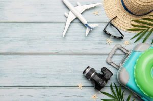 Travel accessories on a wooden background