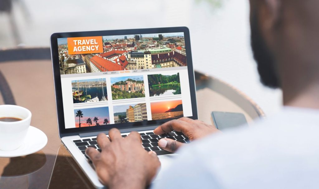 Black Man Using Travel Agency Website On Laptop While Sitting In Cafe, Over Shoulder View, Creative Collage