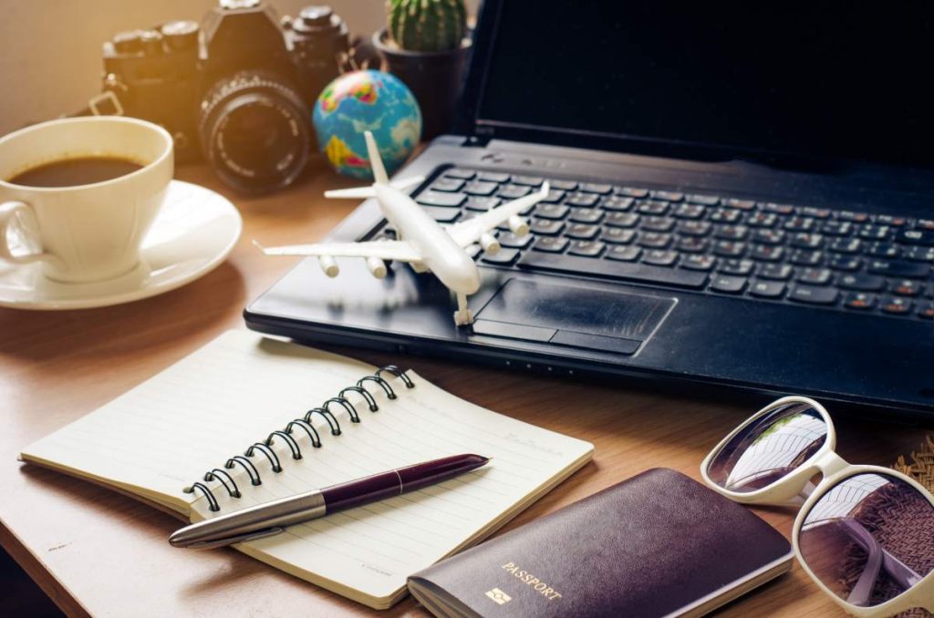 Tourism planning and equipment needed for the trip on wooden floor