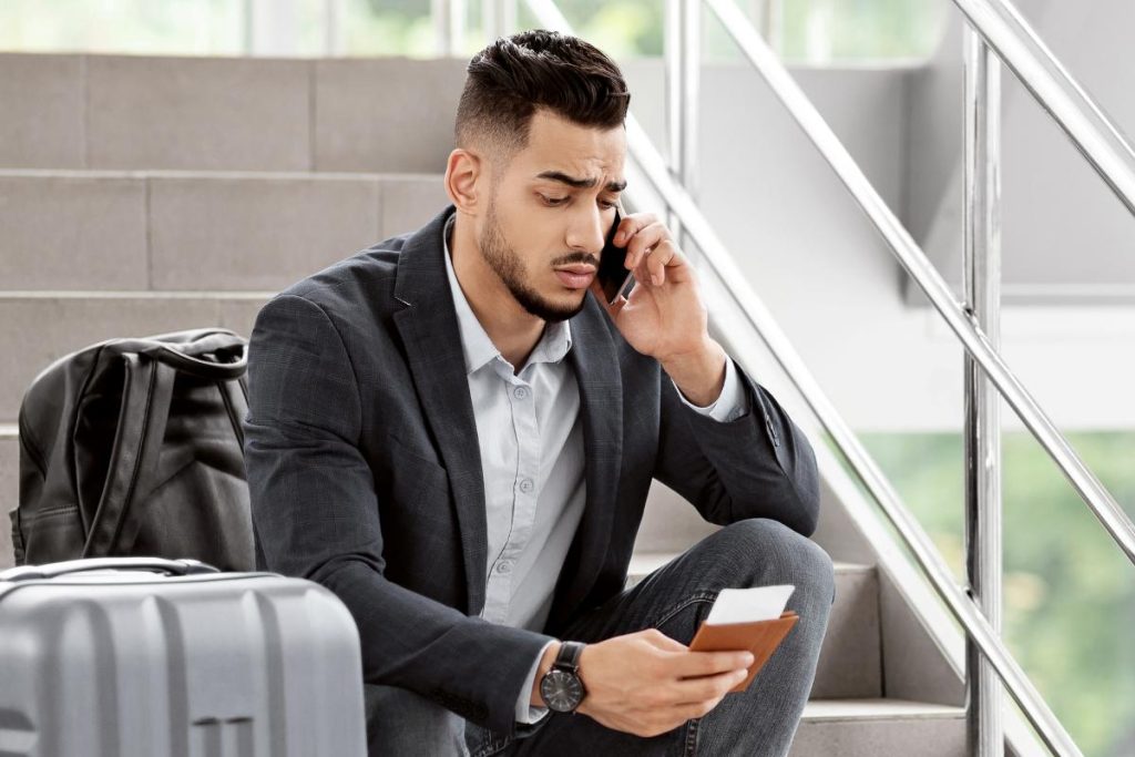 Delayed Flight. Worried Arab Man Talking On Cellphone